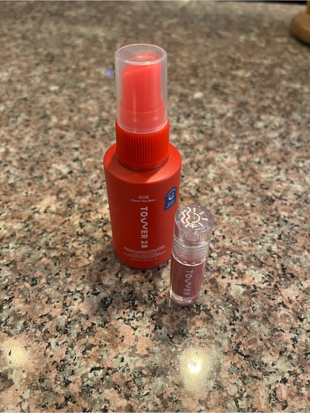 Tower 28 SOS Daily Rescue Spray and Sheer Lip Tint in pistachio